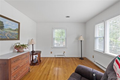 Sitting room featuring light hardwood / wood-style