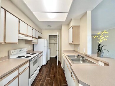 Kitchen with white appliances, under cabinet rang