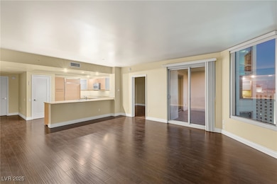 The living room area offers a seamless flow, with slider doors leading directly to the balcony, where you can take in the breathtaking views.