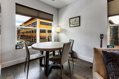 Dining room with baseboards and wood-type flooring