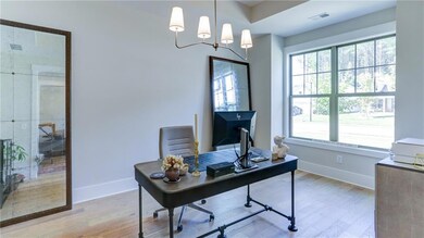 Dining Room with chandelier, but Owner uses as Home Office