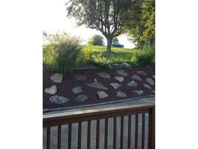 Exterior Front. Landscaped, Mature Pear Tree in ba