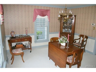 Formal dining room with chair rail and crown moldi