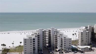 Aerial view with a water view and a beach view