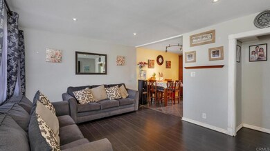 Living room with open access to kitchen.