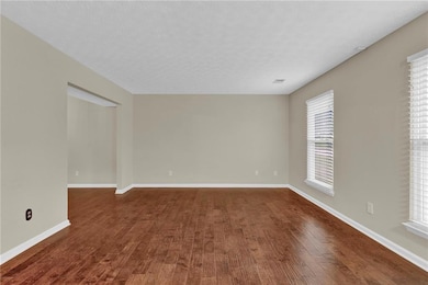 Large living room opens to dining room. So much yo