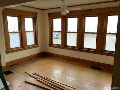 Den. Replacement windows in front room/den