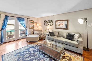 Living room featuring crown molding and hardwood /
