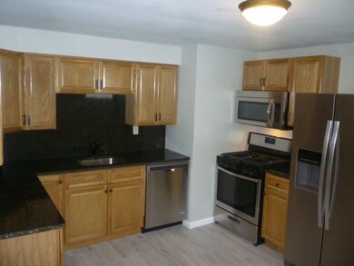 NEW appliances with black granite and backsplash!