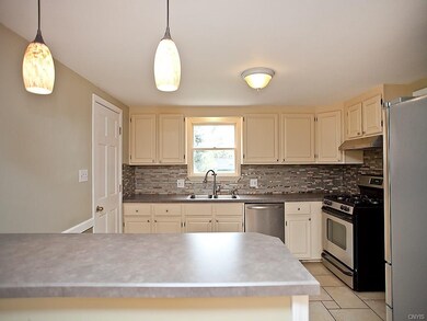Open kitchen dining room with new counter tops, ba