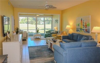 Living room with light tile patterned floors, visi
