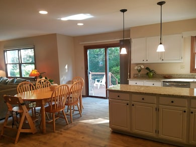 Kitchen & Large Eat In Area with View of Deck