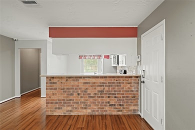 This photo shows a view of the  cozy kitchen area