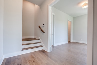 Entry on first floor, looking into the first floor bedroom.