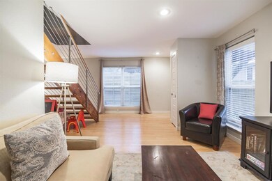 Living area featuring baseboards, wood finished f