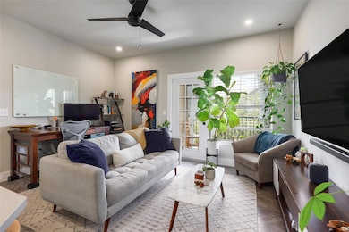 Living area featuring ceiling fan, recessed light