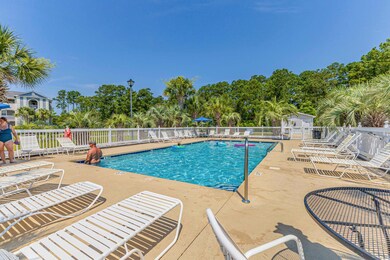 Community pool with fence, a patio, and view of sc