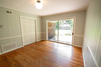 Bedroom room with hardwood / wood-style flooring