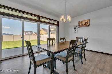 Roomy Dining Room with Back Yard View