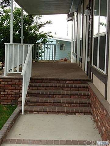 Wide Brick steps to front door & covered porch
