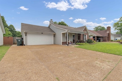 Ranch-style house with a porch, brick siding, driveway, a garage, and a shingled roof
