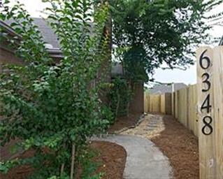 Front walkway..  stone path leads to outside stora