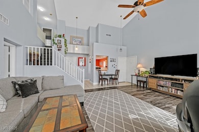 Living room featuring visible vents, wood finished