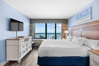 Bedroom with oceanfront view, wood lvp flooring an