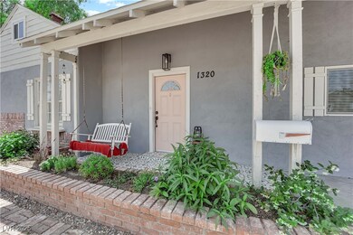 Entrance to property featuring a porch and stucco
