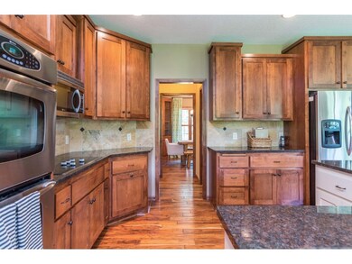 Elegant custom cabinetry, tons of granite counter 