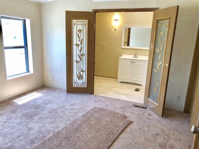Master bedroom with high ceilings and huge bathroo