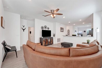 This spacious living room features high ceilings,