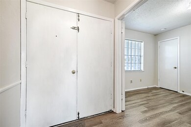 View of double front door in foyer entry with bedr