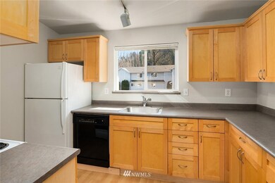 Bright kitchen with ample countertop workspace and storage.