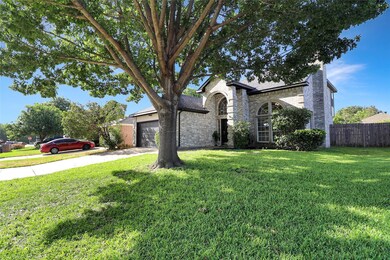 View of front of home featuring a garage and a fro