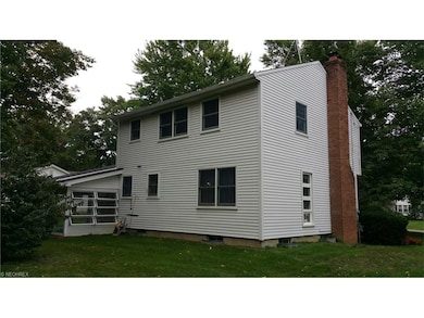 View looking southeast showing chimney for the woo