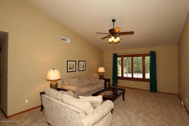 Living Room w/ Wood Plantation Shutters
