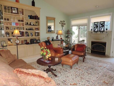 Spacious great room with custom bookshelves and fireplace