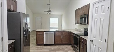 Kitchen featuring appliances with stainless steel
