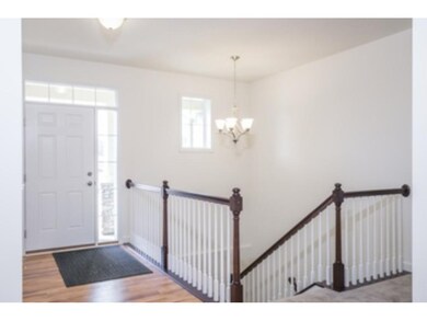 Foyer area and stairs to basement.