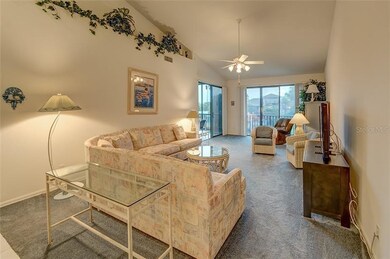 Dining room/living room combo with high ceiling.