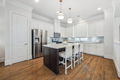 The kitchen showcases a clean, modern design with
