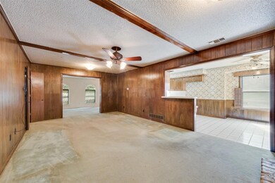 Unfurnished room with visible vents, baseboards, a