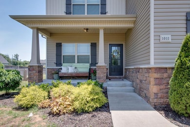 Yessss! A front porch large enough to utilize..beautifully accentuated by striking stone columns.