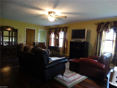 family room with rich colored laminate flooring