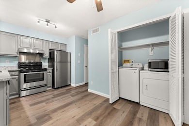 Kitchen with stainless steel appliances, under ca