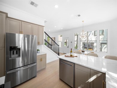 Kitchen featuring a notable chandelier, recessed 