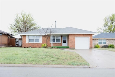 Ranch-style house featuring brick siding, a front 