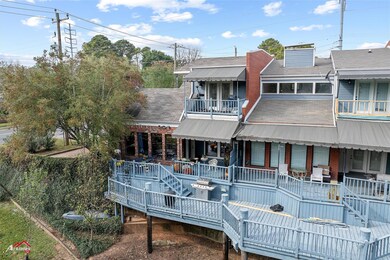 Rear view of property with a balcony