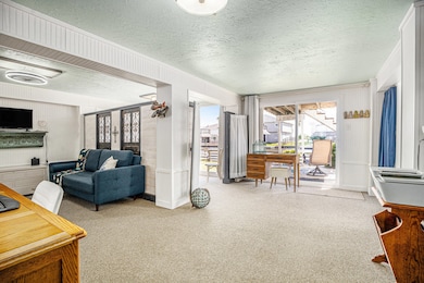 Sliding glass door leads to the backyard patio